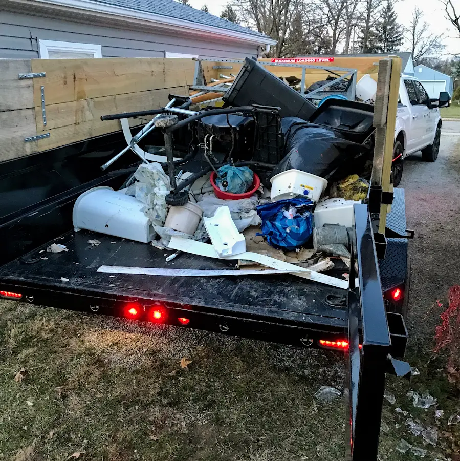 Roll-off dumpster delivered to a residential driveway in Escanaba